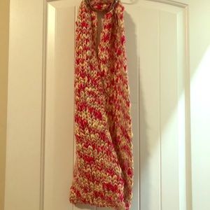 Pink colored infinity scarf.